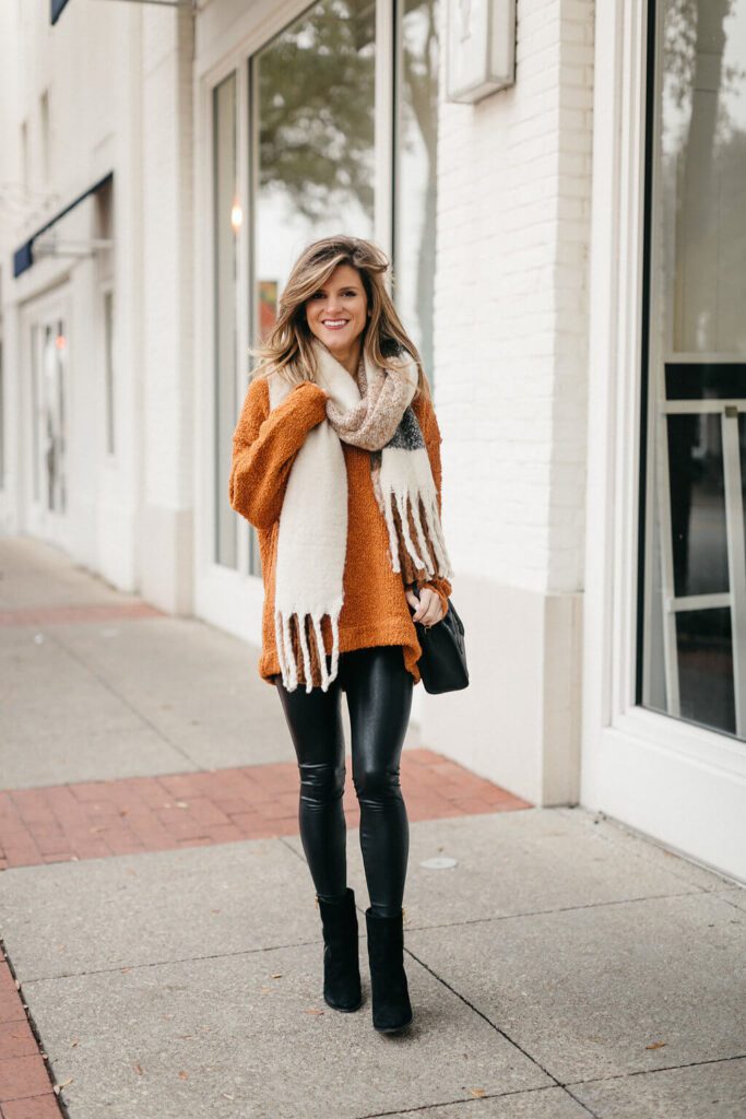 oversized cardigan with ankle boots and leather pants