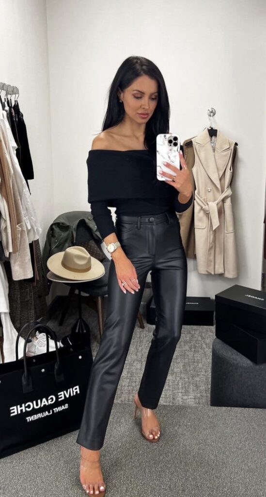 off-shoulder sweater paired with black leather pants