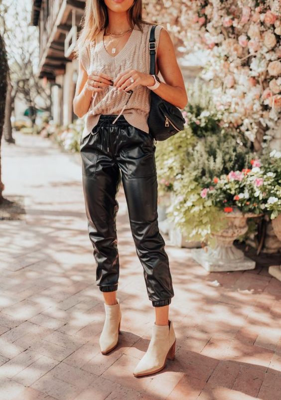 Sleeveless sweater vest with black leather pants